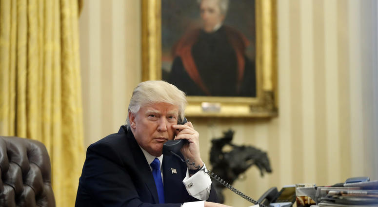 In this Saturday, Jan. 28, 2017 file photo, President Donald Trump speaks on the telephone with Australian Prime Minister Malcolm Turnbull in the Oval Office of the White House in Washington. Donald Trump