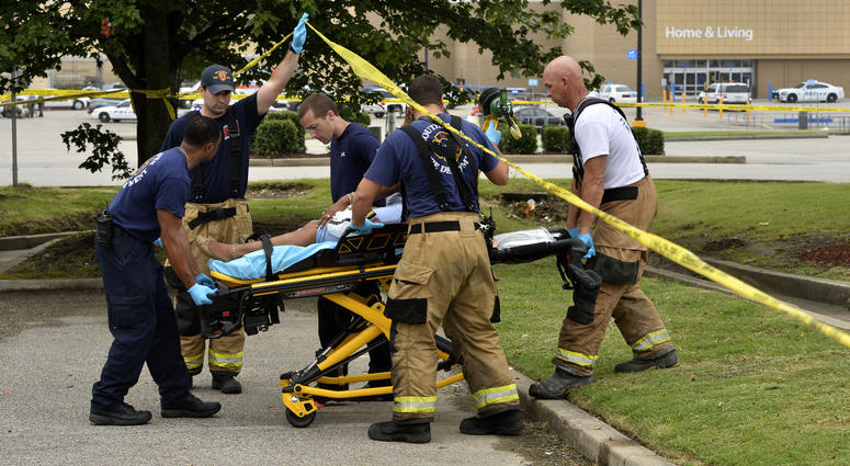 Paramedics offer medical attention after a shooting at a Walmart store Tuesday, July 30, 2019 in Southaven, Miss. Paramedics offer medical attention after a shooting at a Walmart store Tuesday, July 30, 2019 in Southaven, Miss.