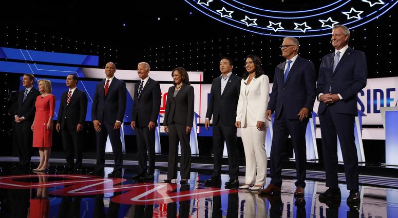 From left: Michael Bennet, Kirsten Gillibrand, Julian Castro, Cory Booker, Joe Biden, Kamala Harris, Andrew Yang, Tulsi Gabbard, Jay Inslee and Bill de Blasio are shown before the second of two Democratic debates Wednesday, July 31, 2019, in Detroit. From left: Michael Bennet, Kirsten Gillibrand, Julian Castro, Cory Booker, Joe Biden, Kamala Harris, Andrew Yang, Tulsi Gabbard, Jay Inslee and Bill de Blasio are shown before the second of two Democratic debates Wednesday, July 31, 2019, in Detroit.