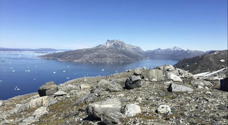 In this image taken on June 15, 2019 small pieces of ice float in the water in Nuuk Fjord, Greenland. In this image taken on June 15, 2019 small pieces of ice float in the water in Nuuk Fjord, Greenland.