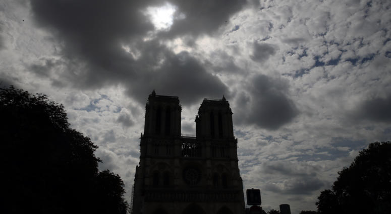 Notre Dame cathedral is silhouetted as environmental groups and unionists attend a news conference to warn against lead particles polluting the air in the area, and ask for a regularly updated chart showing pollution levels in Paris, France. Notre Dame cathedral is silhouetted as environmental groups and unionists attend a news conference to warn against lead particles polluting the air in the area, and ask for a regularly updated chart showing pollution levels in Paris, France.