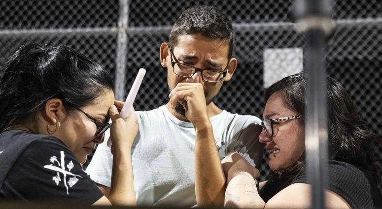 Three Walmart workers, Melisa Gonzalez, Jesus Romero and Raven Ramos, who helped people to escape during the mass shooting on Saturday, Aug. 3, 2019, get emotional during during a vigil at Ponder Park in honor of the shooting victims in El Paso, Texas. Three Walmart workers, Melisa Gonzalez, Jesus Romero and Raven Ramos, who helped people to escape during the mass shooting on Saturday, Aug. 3, 2019, get emotional during during a vigil at Ponder Park in honor of the shooting victims in El Paso, Texas.