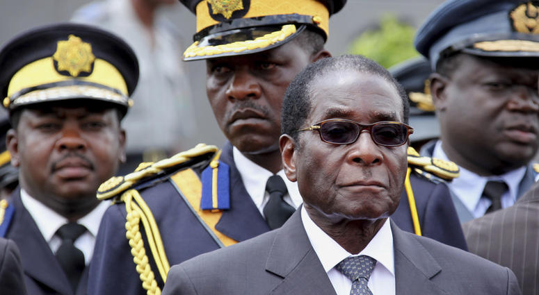 Zimbabwe President Robert Mugabe arrives for the burial of a prominent member of his party, Misheck Chando, in Harare, on Sat. Oct. 31, 2009. Zimbabwe President Robert Mugabe arrives for the burial of a prominent member of his party, Misheck Chando, in Harare, on Sat. Oct. 31, 2009.