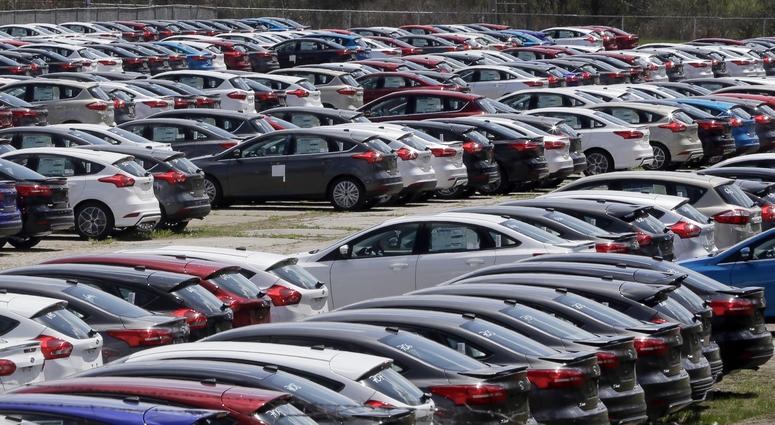 In this May 1, 2015, file photo Ford Focus vehicles are seen on a storage lot in Ypsilanti, Mich. Ford is extending the warranties on about 560,000 small cars to cover a litany of problems with a troubled six-speed automatic transmission. In this May 1, 2015, file photo Ford Focus vehicles are seen on a storage lot in Ypsilanti, Mich. Ford is extending the warranties on about 560,000 small cars to cover a litany of problems with a troubled six-speed automatic transmission.