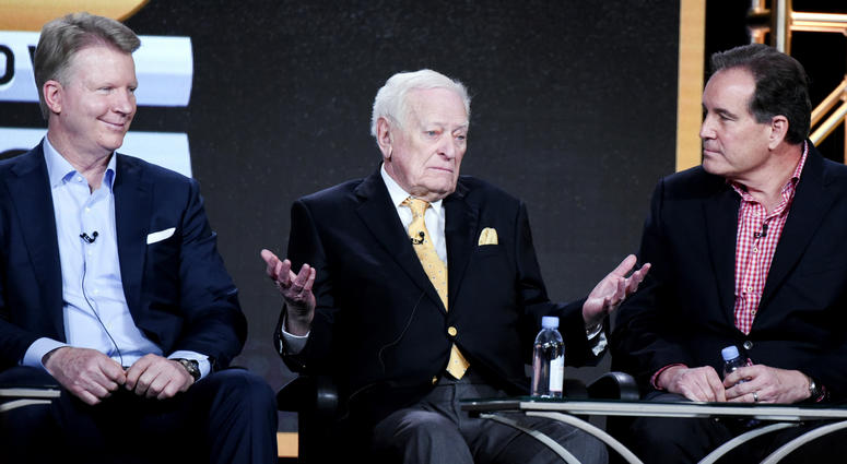 In this Jan. 12, 2016, file photo, from left to right, sportscasters Phil Simms, Jack Whitaker and Jim Nantz participate in the "CBS Sports" panel at the CBS 2016 Winter TCA in Pasadena, Calif. Jack Whitaker