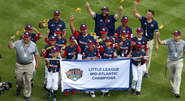 In this Aug. 15, 2019, file photo, the Mid-Atlantic Region Champion Little League team from Elizabeth, N.J. participates in the opening ceremony of the 2019 Little League World Series baseball tournament in South Williamsport, Pa. In this Aug. 15, 2019, file photo, the Mid-Atlantic Region Champion Little League team from Elizabeth, N.J. participates in the opening ceremony of the 2019 Little League World Series baseball tournament in South Williamsport, Pa.