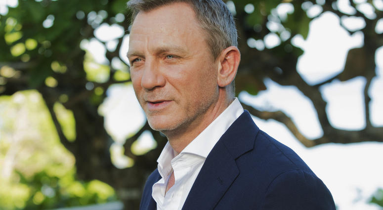 In this April 25, 2019, file photo, actor Daniel Craig poses for photographers during the photo call of the latest installment of the James Bond film franchise, in Oracabessa, Jamaica. In this April 25, 2019, file photo, actor Daniel Craig poses for photographers during the photo call of the latest installment of the James Bond film franchise, in Oracabessa, Jamaica.