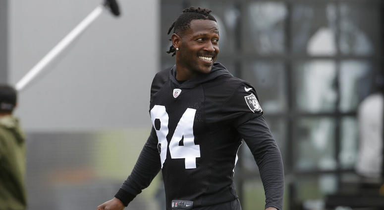 In this Aug. 20, 2019 file photo, Oakland Raiders' Antonio Brown smiles before stretching during NFL football practice in Alameda, Calif. Brown was released by the Raiders, Saturday, Sept. 7, 2019. Antonion Brown