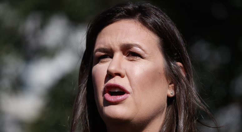 In this June 11, 2019 file photo, White House press secretary Sarah Sanders talks with reporters outside the White House in Washington. Sarah Sanders