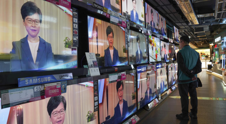 A man watches the television message that Hong Kong Chief Executive Carrie Lam makes an announcement on the extradition bill, at a home electronics retailer in Hong Kong, on Wednesday, Sept. 4, 2019. A man watches the television message that Hong Kong Chief Executive Carrie Lam makes an announcement on the extradition bill, at a home electronics retailer in Hong Kong, on Wednesday, Sept. 4, 2019.