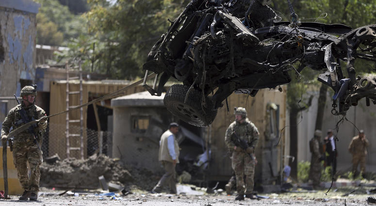 Resolute Support (RS) forces remove a damaged vehicle after a car bomb explosion in Kabul, Afghanistan, Thursday, Sept. 5, 2019. Resolute Support (RS) forces remove a damaged vehicle after a car bomb explosion in Kabul, Afghanistan, Thursday, Sept. 5, 2019.