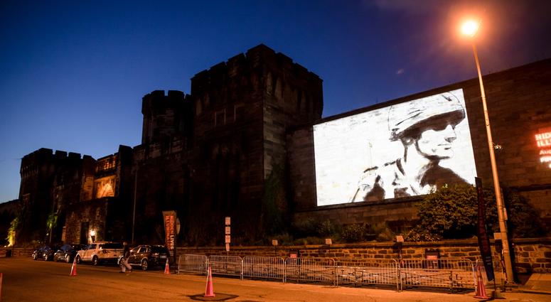 A guest film by Dee Hibbert-Jones and Nomi Talisman, titled "Last Day of Freedom" is projected on the wall of Eastern State Penitentiary in Philadelphia. A guest film by Dee Hibbert-Jones and Nomi Talisman, titled "Last Day of Freedom" is projected on the wall of Eastern State Penitentiary in Philadelphia.