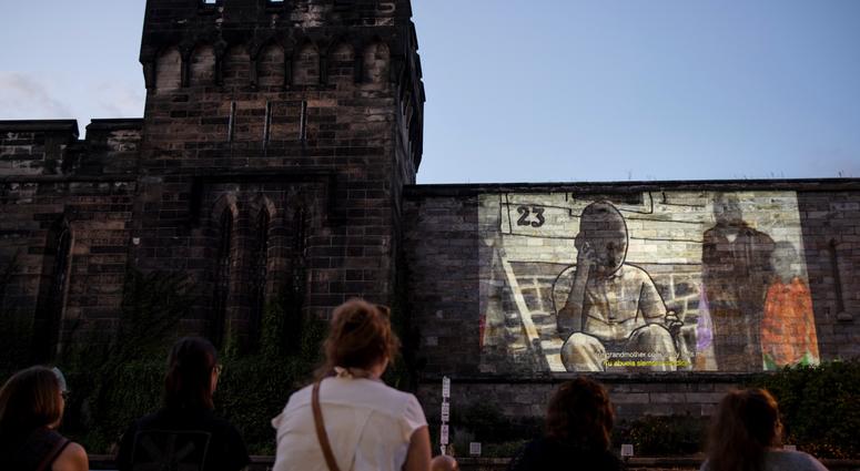 People view incarcerated filmmaker Robert's animated short titled "A Special Person" projected on the wall of Eastern State Penitentiary in Philadelphia. People view incarcerated filmmaker Robert's animated short titled "A Special Person" projected on the wall of Eastern State Penitentiary in Philadelphia.