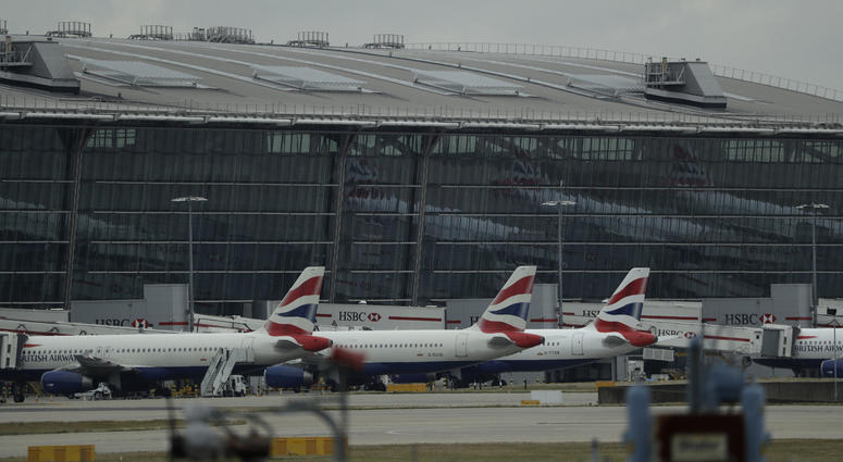 British Airways planes sit parked at Heathrow Airport in London, Sept. 9, 2019. British Airways says it has had to cancel almost all flights as a result of a pilots' 48-hour strike over pay. British Airways