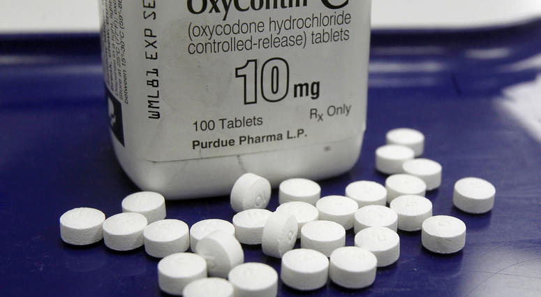 Aa pharmacist in San Francisco poses for photos holding a bottle of OxyContin. Aa pharmacist in San Francisco poses for photos holding a bottle of OxyContin.
