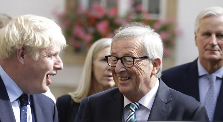European Commission President Jean-Claude Juncker, center, speaks with British Prime Minister Boris Johnson, left, after a meeting in Luxembourg, Monday, Sept. 16, 2019. European Commission President Jean-Claude Juncker, center, speaks with British Prime Minister Boris Johnson, left, after a meeting in Luxembourg, Monday, Sept. 16, 2019.