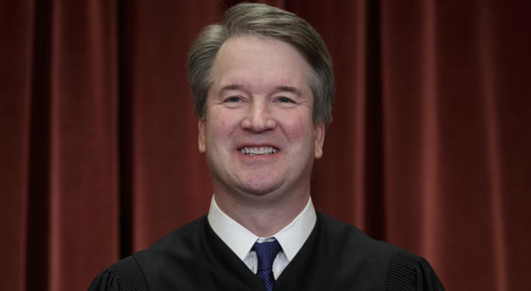 In this Nov. 30, 2018, file photo Associate Justice Brett Kavanaugh sits with fellow Supreme Court justices for a group portrait at the Supreme Court Building in Washington. Brett Kavanaugh