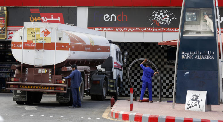 Workers refuel the tank at a gas station in Jiddah, Saudi Arabia, Tuesday, Sept. 17, 2019. Workers refuel the tank at a gas station in Jiddah, Saudi Arabia, Tuesday, Sept. 17, 2019.