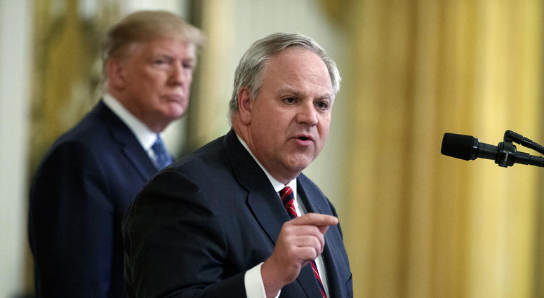President Donald Trump listens as then-Secretary of the Interior David Bernhardt speaks during an event on the environment in the East Room of the White House in Washington. President Donald Trump listens as then-Secretary of the Interior David Bernhardt speaks during an event on the environment in the East Room of the White House in Washington.