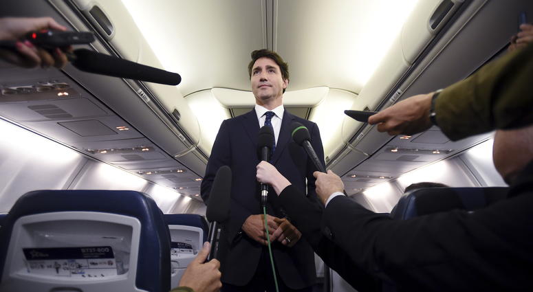 Canadian Prime Minister and Liberal Party leader Justin Trudeau makes a statement in regards to a photo coming to light of himself from 2001, wearing "brownface," during a scrum on his campaign plane in Halifax, Nova Scotia, Wednesday, Sept. 18, 2019. Canadian Prime Minister and Liberal Party leader Justin Trudeau makes a statement in regards to a photo coming to light of himself from 2001, wearing "brownface," during a scrum on his campaign plane in Halifax, Nova Scotia, Wednesday, Sept. 18, 2019.