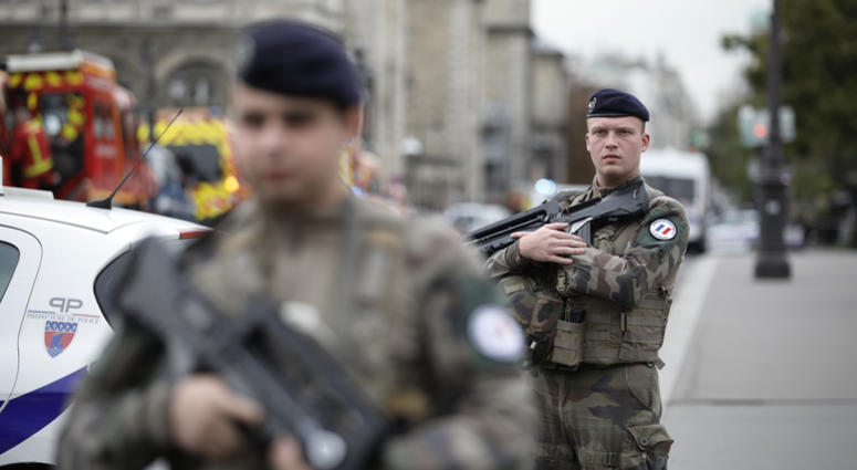 Armed soldiers patrol after an incident at the police headquarters in Paris, Thursday, Oct. 3, 2019. A French police union official says an attacker armed with a knife has killed one officer inside Paris police headquarters before he was shot and killed. Armed soldiers patrol after an incident at the police headquarters in Paris, Thursday, Oct. 3, 2019. A French police union official says an attacker armed with a knife has killed one officer inside Paris police headquarters before he was shot and killed.