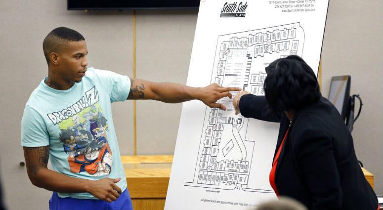 In this Tuesday, Sept. 24, 2019, photo, victim Botham Jean's neighbor Joshua Brown, left, answers questions from Assistant District Attorney LaQuita Long, right. Victim Botham Jean's neighbor Joshua Brown, left, answers questions from Assistant District Attorney LaQuita Long, right