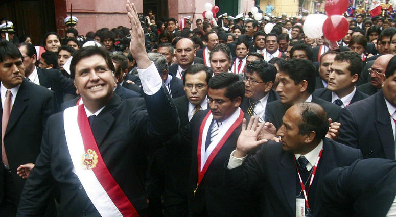 In this July 28, 2006 file photo, Peruvian President Alan García waves to a crowd after his swearing-in ceremony while he walks through the streets of Lima, Peru. In this July 28, 2006 file photo, Peruvian President Alan García waves to a crowd after his swearing-in ceremony while he walks through the streets of Lima, Peru.
