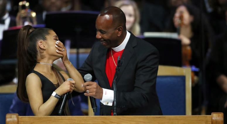 Ariana Grande, left, laughs with Bishop Charles H. Ellis during the funeral service for Aretha Franklin at Greater Grace Temple, Friday, Aug. 31, 2018, in Detroit. Franklin died Aug. 16, 2018 of pancreatic cancer at the age of 76. Ariana Grande, left, laughs with Bishop Charles H. Ellis during the funeral service for Aretha Franklin at Greater Grace Temple, Friday, Aug. 31, 2018, in Detroit. Franklin died Aug. 16, 2018 of pancreatic cancer at the age of 76.