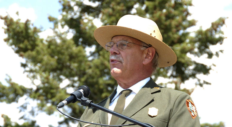 This August 17, 2017 file photo shows Yellowstone Superintendent Dan Wenk speaking at an event marking a conservation agreement for a former mining site just north of the park in Jardine, Mont. Yellowstone Superintendent Dan Wenk