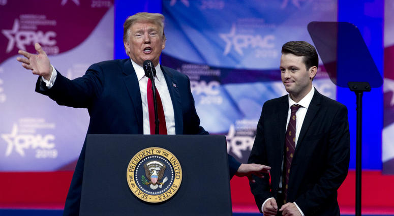 In this March 2, 2019 photo, President Donald Trump invites to the podium, Hayden Williams, a field representative of the Leadership Institute, who was assaulted at Berkeley campus, at the Conservative Political Action Conference, CPAC 2019, in Oxon Hill, In this March 2, 2019 photo, President Donald Trump invites to the podium, Hayden Williams, a field representative of the Leadership Institute, who was assaulted at Berkeley campus, at the Conservative Political Action Conference, CPAC 2019, in Oxon Hill,