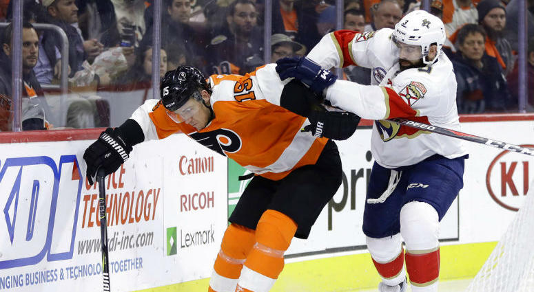 Philadelphia Flyers' Jori Lehtera, left, tries to keep Florida Panthers' Keith Yandle away from the puck during the second period of an NHL hockey game, Tuesday, Nov. 13, 2018, in Philadelphia.