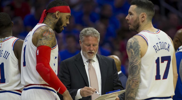 Head coach Brett Brown of the Philadelphia 76ers talks to Mike Scott and JJ Redick against the Toronto Raptors in Game Three of the Eastern Conference Semifinals at the Wells Fargo Center on May 2, 2019 in Philadelphia, Pennsylvania. Brett Brown talks to Mike Scott and JJ Redick during Game Three.