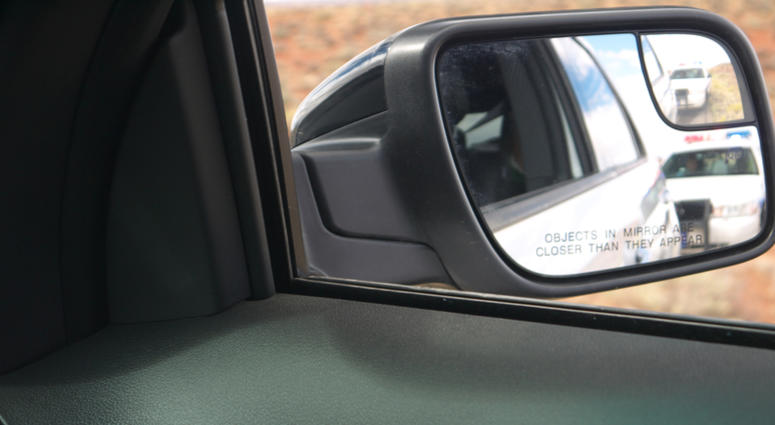 Police in the side-view mirror Police in the side-view mirror