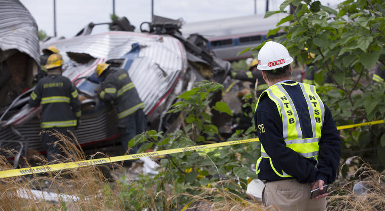 In this handout image supplied by NTSB, NTSB member Robert Sumwalt works on the scene of the Amtrak Train #188 derailment on May 13, 2015 in Philadelphia, Pennsylvania. NTSB
