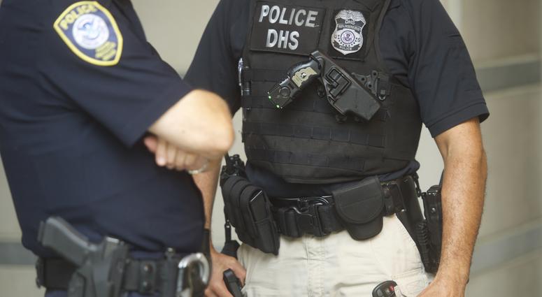 Police officers monitor activity outside the Martin Luther King, Jr. Federal Courthouse, as opening statements are heard in the "Bridgegate" trial on September 19, 2016 in Newark, New Jersey. New Jersey police officers