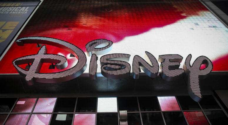 The Disney logo is displayed outside the Disney Store in Times Square, December 14, 2017 in New York City. Disney