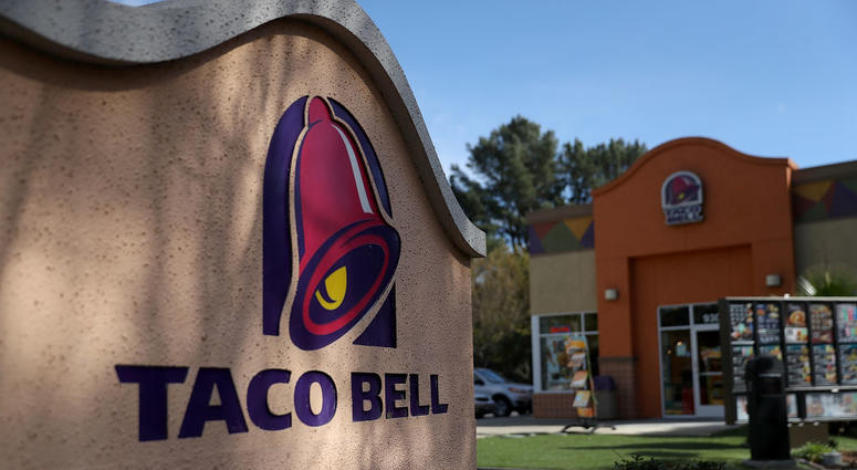 A sign is posted in front of a Taco Bell restaurant on Feb. 22, 2018 in Novato, California. Taco Bell