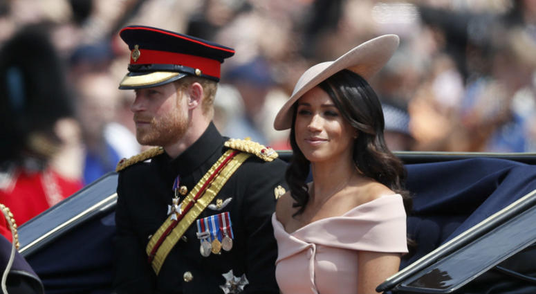 Britain's Prince Harry, left, and Meghan, Duchess of Sussex ride in a carriage to attend the annual Trooping the Colour Ceremony in London, Saturday, June 9, 2018. Britain's Prince Harry, left, and Meghan, Duchess of Sussex ride in a carriage to attend the annual Trooping the Colour Ceremony in London, Saturday, June 9, 2018.