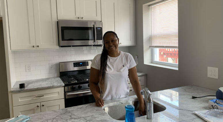 Angela Kraddock in her kitchen. She used the Philly First Home program to buy her first home. Philadelphia's expanded program to help first-time homebuyers is off to a running start. In its first month, more than 100 people have used the program become homeowners, and the process is proving surprisingly easy to navigate.