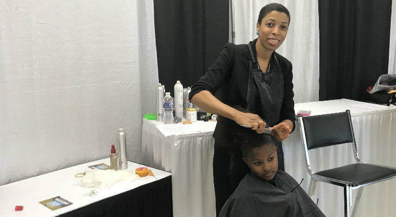 Barbers offered free haircuts for kids during the event. Barbers offered free haircuts for kids during the event.