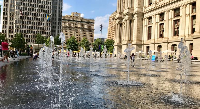 People play in the fountains of Dilworth Park outside of Philadelphia City Hall. Dilworth Park