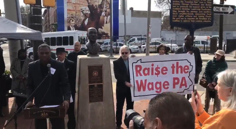 Rev. Gregory Holston, executive director of POWER, speaks from the podium April 4, 2019 about working to raise the minimum wage in Pennsylvania to $15. State Senate Democrats lead a call to action on poverty.