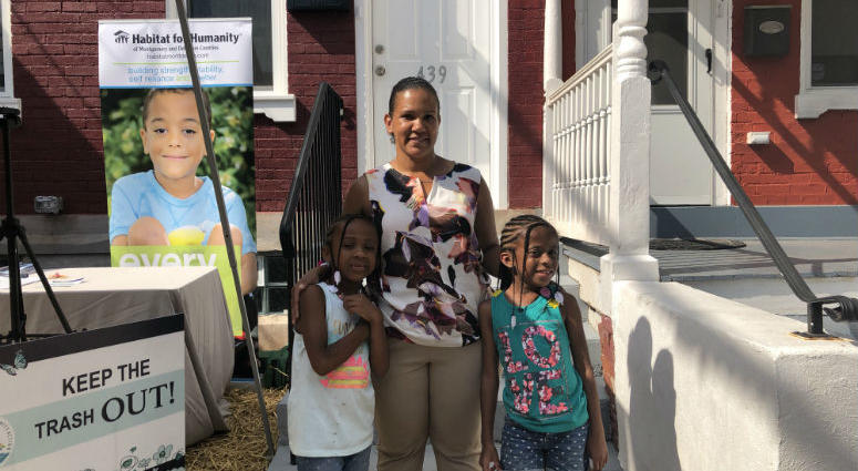 Veteran Tamara Charles in front of her brand new Habitat for Humanity home. Tamara Charles