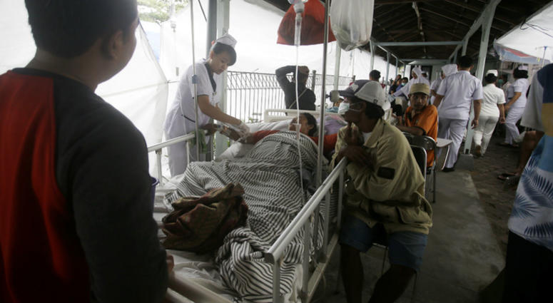 Patients are evacuated outside a hospital, following an earthquake in Bali, Indonesia, Monday, Aug. 6, 2018. Patients are evacuated outside a hospital, following an earthquake in Bali, Indonesia, Monday, Aug. 6, 2018.