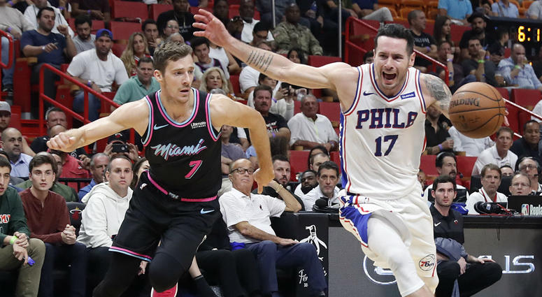 Philadelphia 76ers guard JJ Redick drives the ball to the basket against Miami Heat guard Goran Dragic in the first half of an NBA basketball game on Monday, Nov. 12, 2018, in Miami. Philadelphia 76ers guard JJ Redick drives the ball to the basket against Miami Heat guard Goran Dragic in the first half of an NBA basketball game on Monday, Nov. 12, 2018, in Miami.
