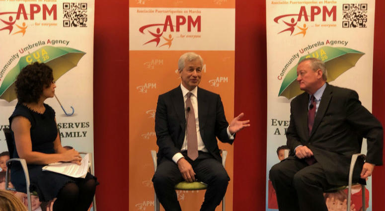 A moderator (left) leads a discussion with Jamie Dimon (middle) and Mayor Jim Kenney (right) about JPMorgan Chase awarding community organizations in Kensington a $5 million grant. A moderator (left) leads a discussion with Jamie Dimon (middle) and Mayor Jim Kenney (right).