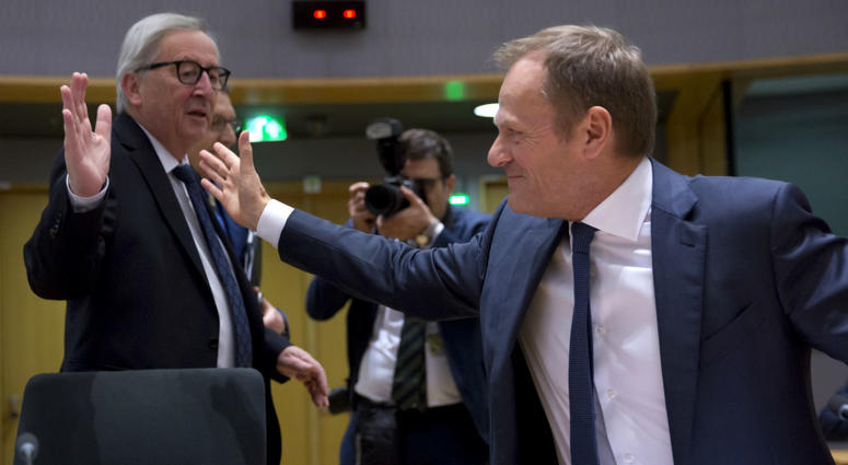 European Commission President Jean-Claude Juncker, left, greets European Council President Donald Tusk during a tripartite social summit at the Europa building in Brussels, Wednesday, March 20, 2019. European Commission President Jean-Claude Juncker, left, greets European Council President Donald Tusk during a tripartite social summit at the Europa building in Brussels, Wednesday, March 20, 2019.