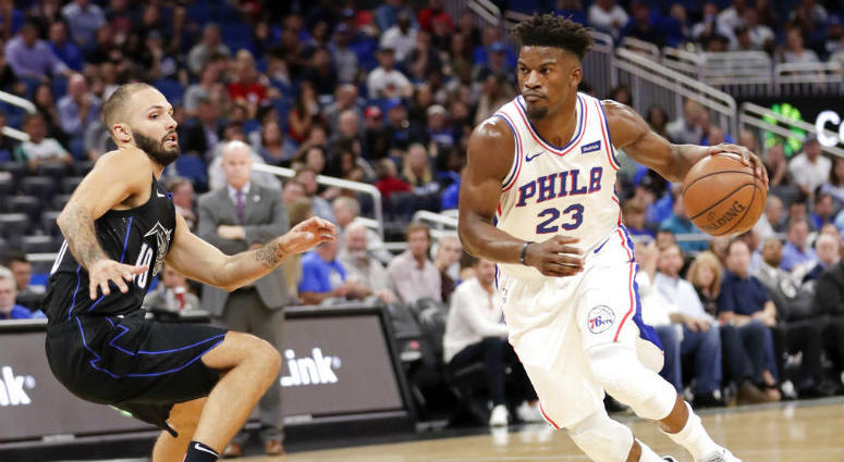 Philadelphia 76ers' Jimmy Butler (23) drives past Orlando Magic's Evan Fournier during the first half of an NBA basketball game Wednesday, Nov. 14, 2018, in Orlando, Fla.