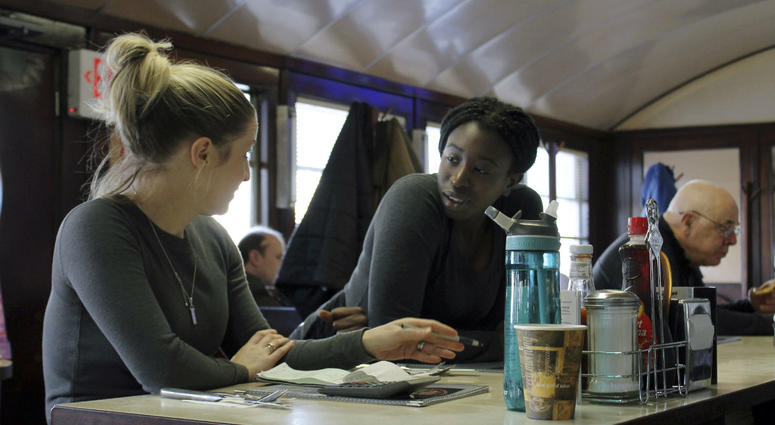 Waitress Kelcie Tipping, left, speaks with fellow waitress Mariam Touray, right, at the Modern Diner in Pawtucket, R.I. Waitress Kelcie Tipping, left, speaks with fellow waitress Mariam Touray, right, at the Modern Diner in Pawtucket, R.I.