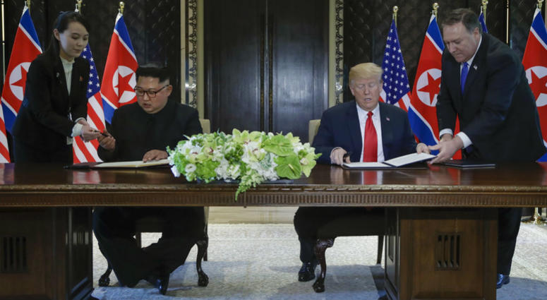 North Korea leader Kim Jong Un and U.S. President Donald Trump prepare to sign a document at the Capella resort on Sentosa Island Tuesday, June 12, 2018 in Singapore. North Korea leader Kim Jong Un and U.S. President Donald Trump